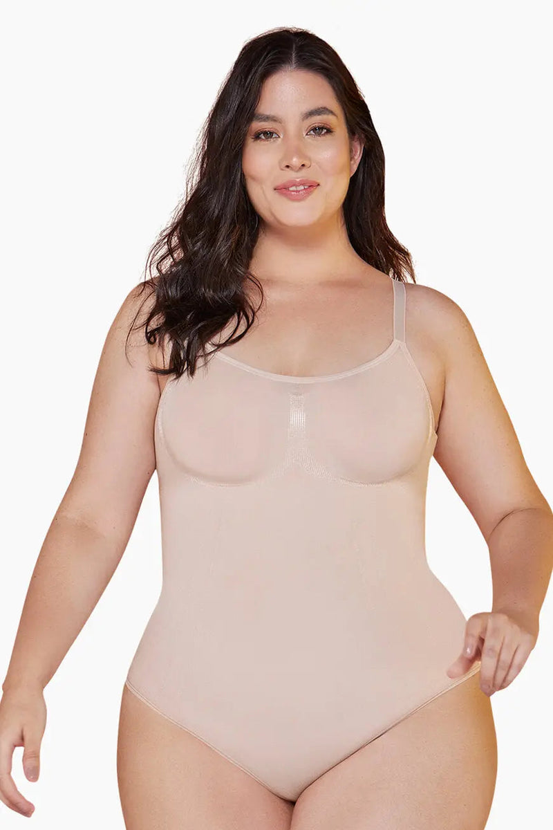 Plus-size model in nude Curveez Comfort Evolution Bodysuit, offering full support and comfort with a body-hugging fit.